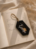 “Escape” resin charm